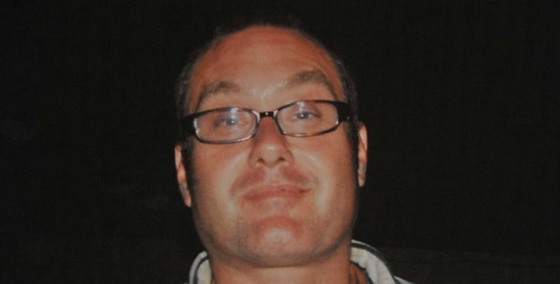 Matt Scott smiling in family photo