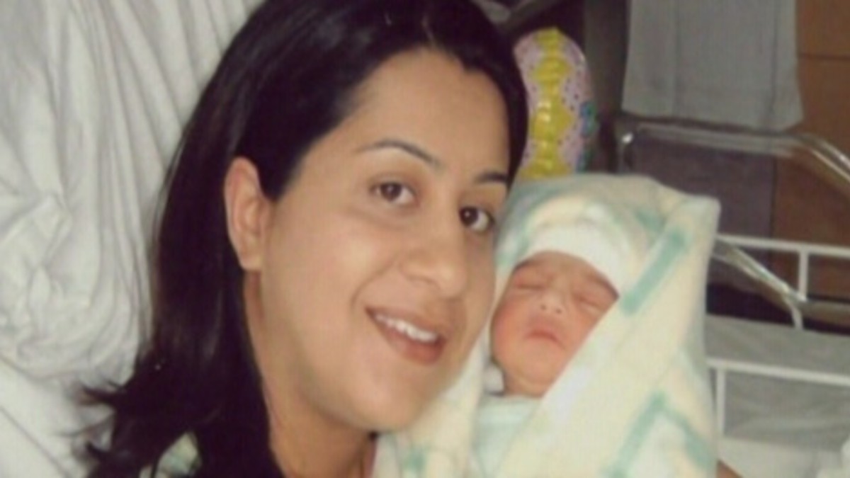 Manjit Panghali holds her newborn baby