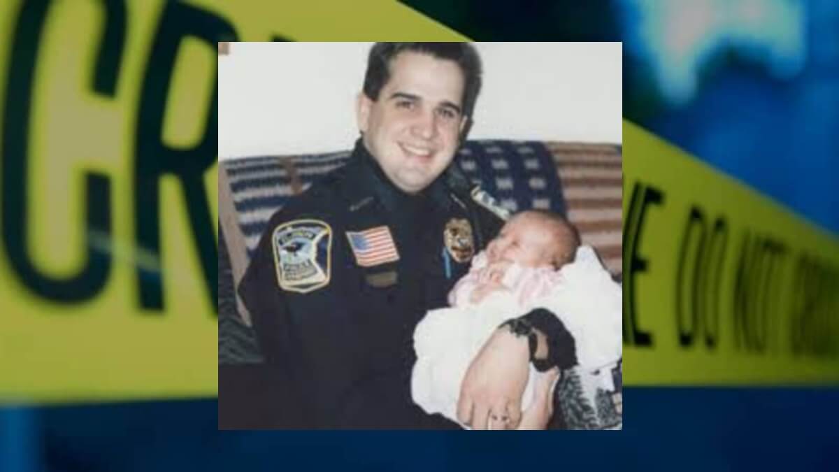 Officer Klinefelter poses with his baby daughter