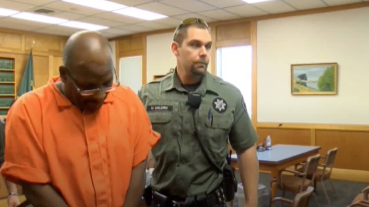 Bisir Muhammad in court being led out in handcuffs