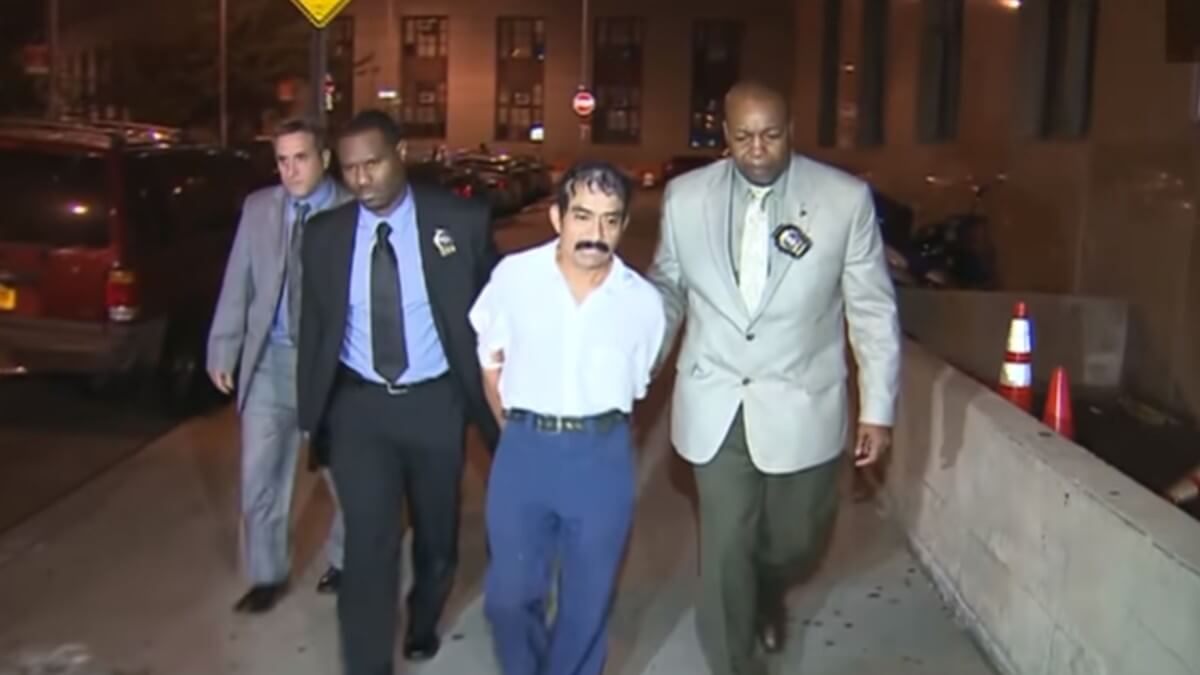 Conrado Juarez escorted by officers