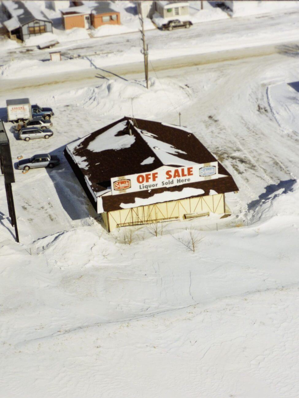 Aerial shot of theFreeway Liquor store, seen in snow. 