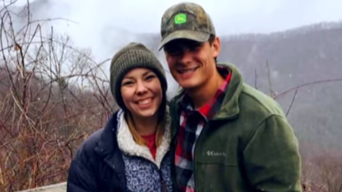 Mary Higdon and Steven Freeman pose in the woods