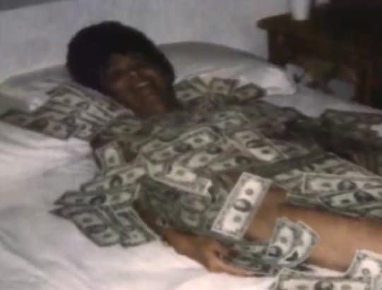 Mary Ellen Samuels naked but covered in $20,000 in cash