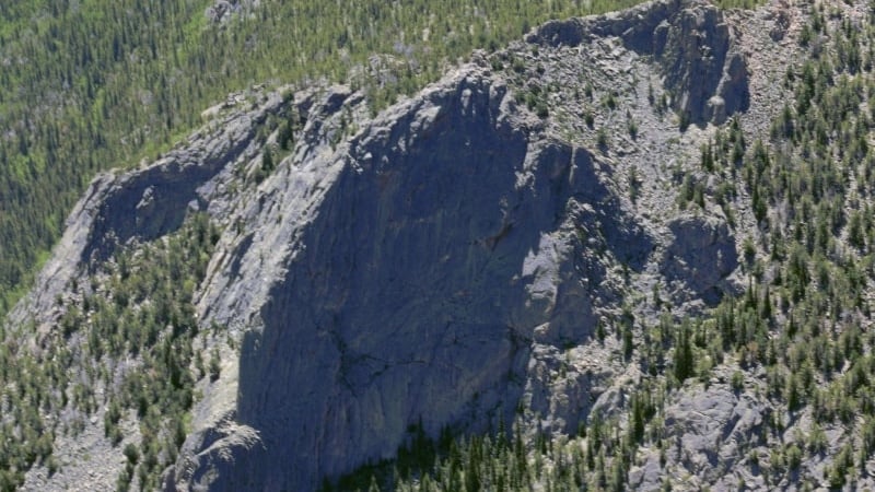 Photo of cliff Toni fell from, high and craggy