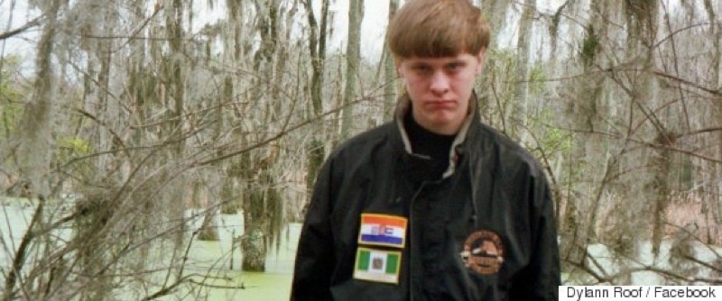 Dylann Roof wearing a jacket with some obscure white supremacy flags on it