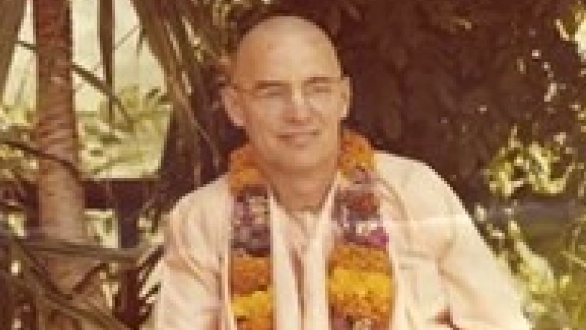Keith Ham aka Kirtanananda Swami poses in robes